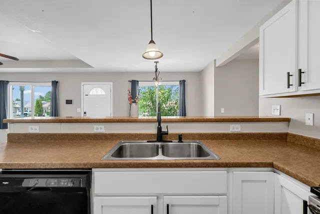 a kitchen with a sink and a window