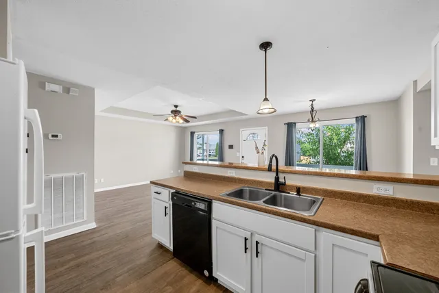 a kitchen with a sink and window