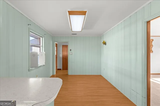 a kitchen with a sink appliances and cabinets