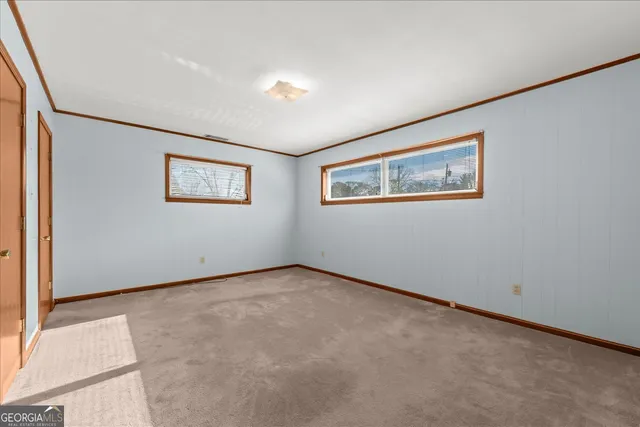 an empty room with a bathroom