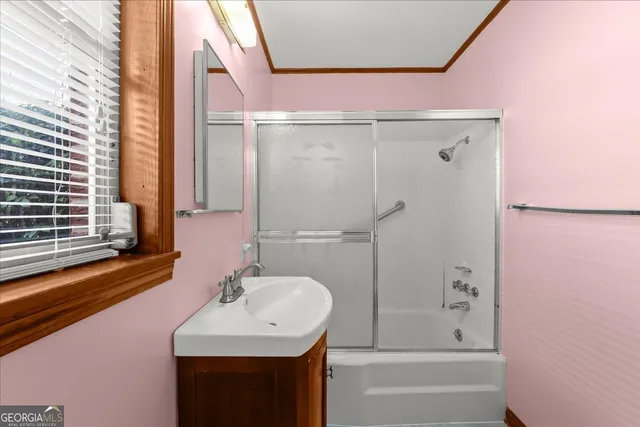 a view of a porch with furniture and garden