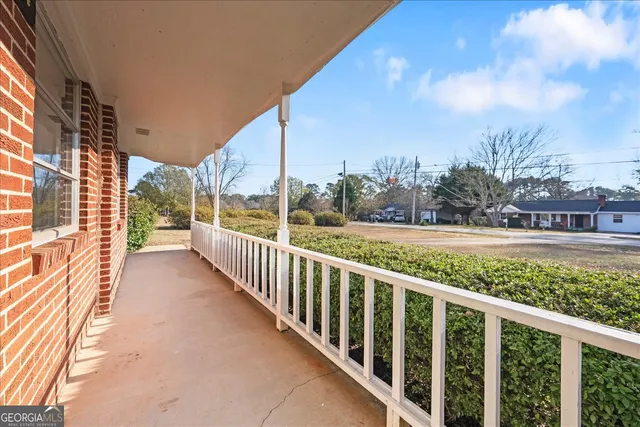 a view of a city street from a balcony