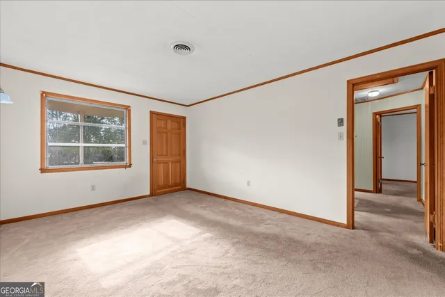 a view of a bathroom with a glass door and a toilet