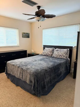 a bedroom with a bed and window