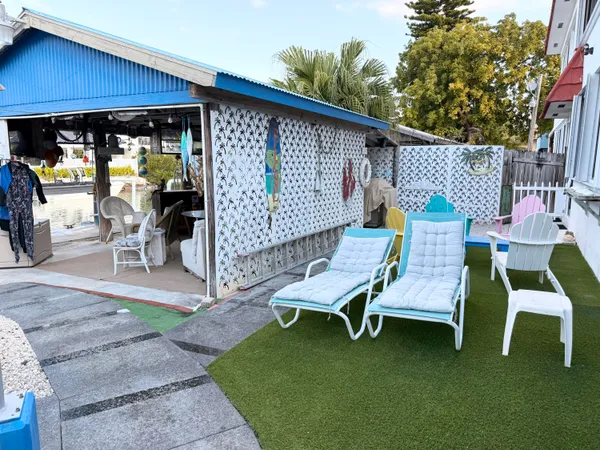 a view of a two chairs in the patio