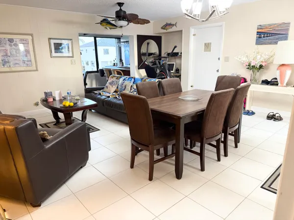 a dining room with a large window and table