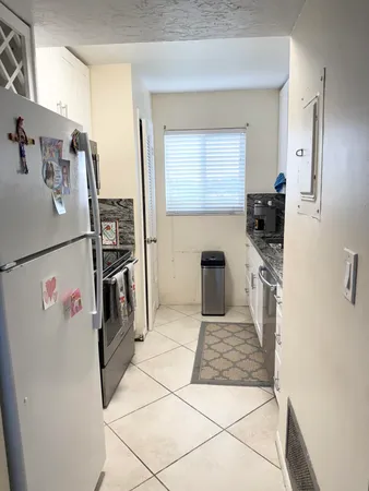 a view of swimming pool with a patio