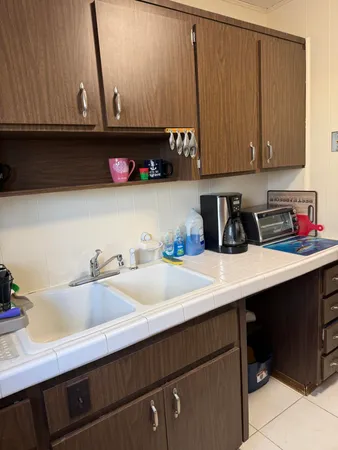 a kitchen with a sink and cabinets