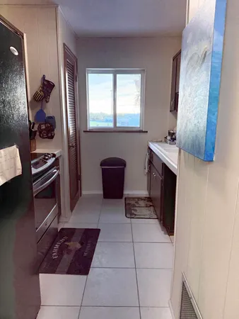 a kitchen with stainless steel appliances a stove a microwave and a refrigerator