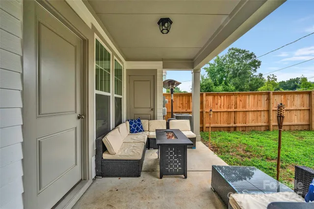 a balcony with furniture and garden view