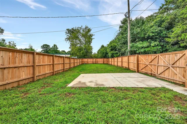 a view of backyard with outdoor space