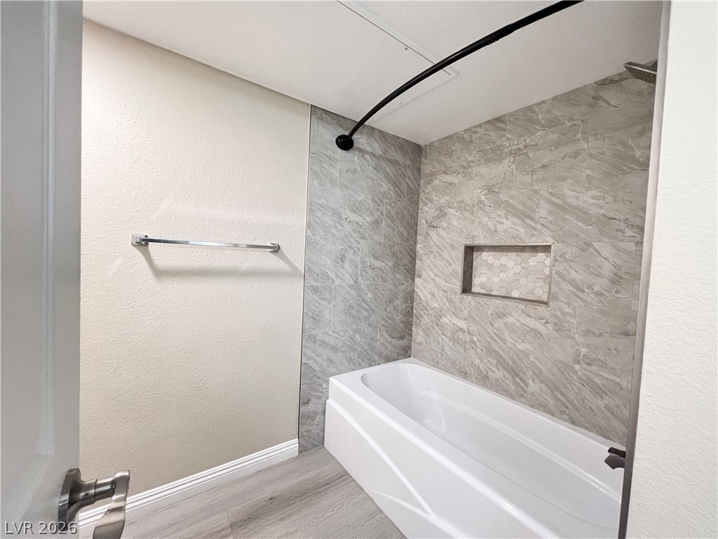 8070 West Russell Road, Unit 2070 Las Vegas, NV 89113 - Photo 8 of 27 Primary bathroom with tile surrounded tub