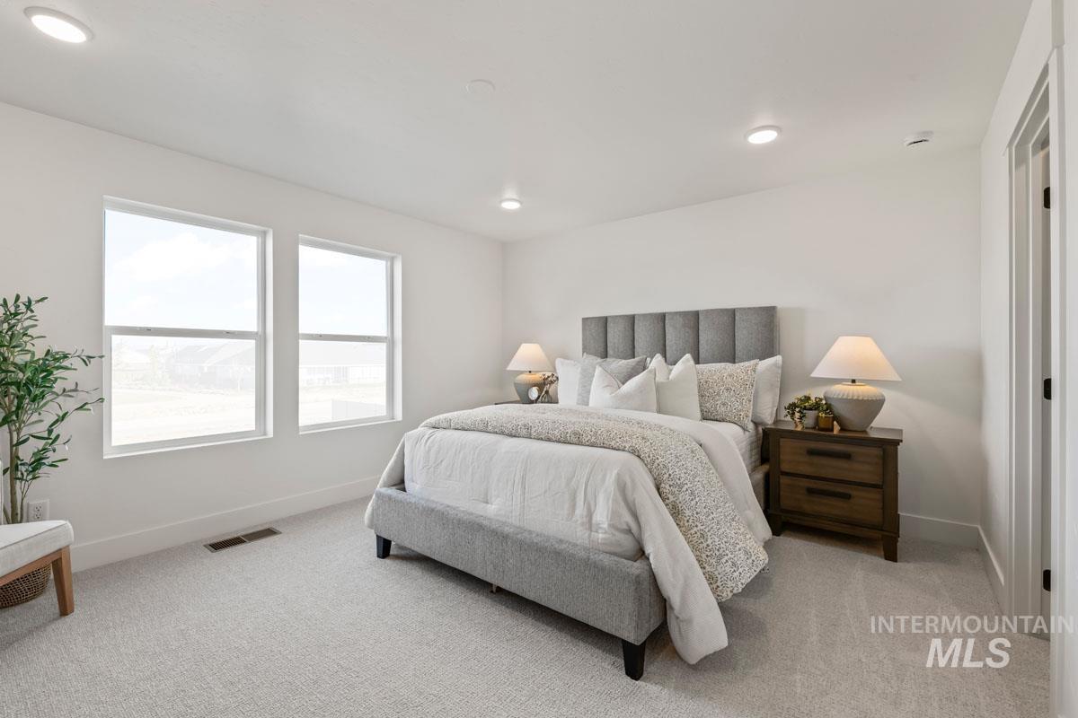 2113 East Deep Purple Lane Meridian, ID 83642 - Photo 5 of 11 Bedroom featuring light carpet and recessed lighting