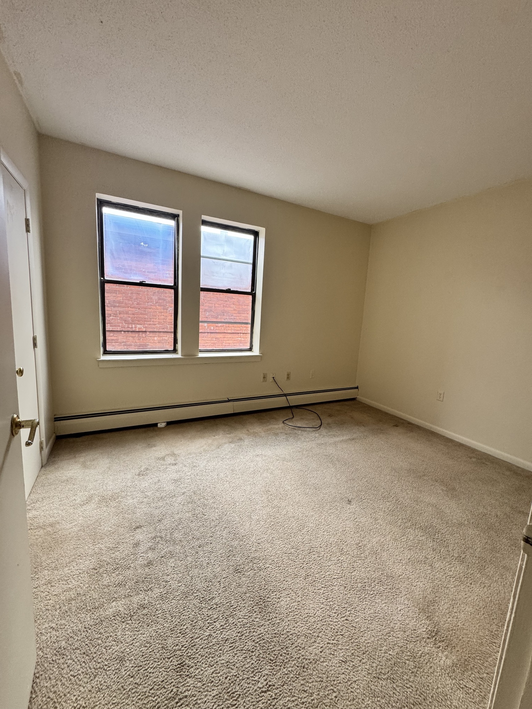 27 Congress Street, Unit 301 Hartford, CT 06114 - Photo 6 of 6 an empty room with windows