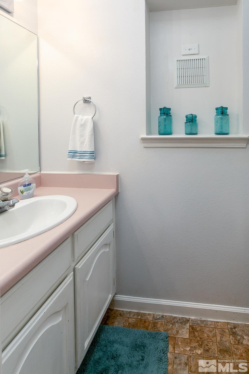 4170 Bottom Road Fallon, NV 89406 - Photo 17 of 38 a bathroom with a sink and a mirror