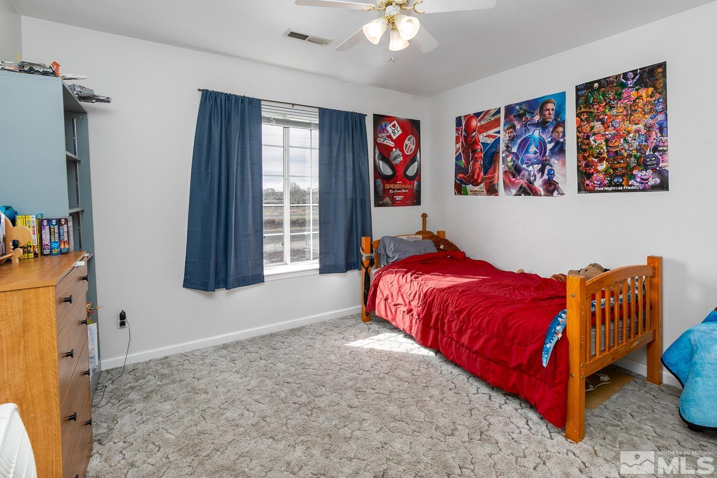 4170 Bottom Road Fallon, NV 89406 - Photo 22 of 38 a bed sitting in a bedroom next to a window
