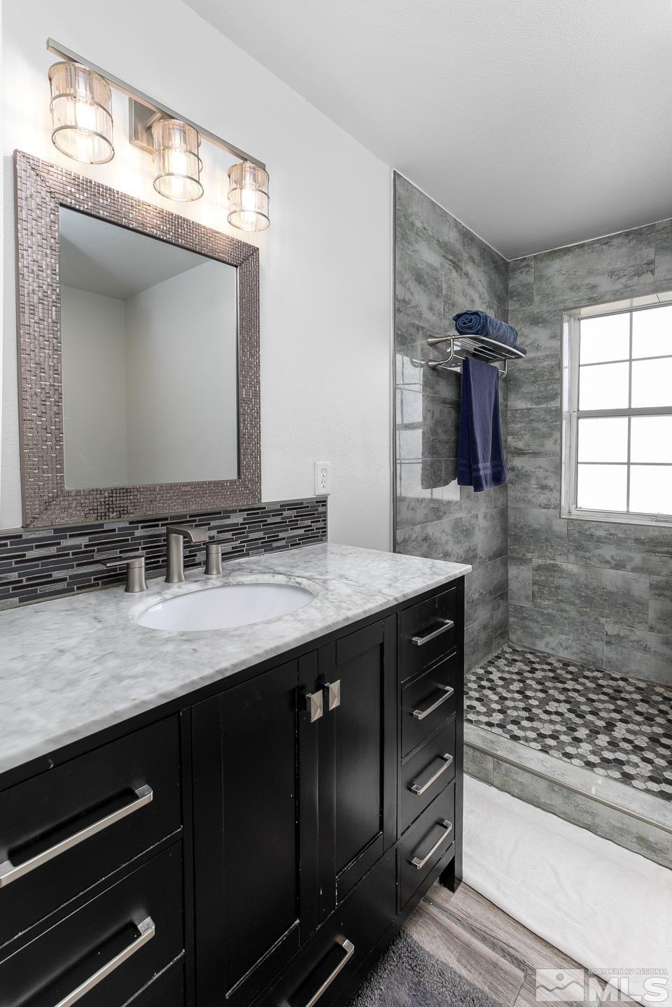 4170 Bottom Road Fallon, NV 89406 - Photo 25 of 38 a bathroom with a sink a vanity and a mirror