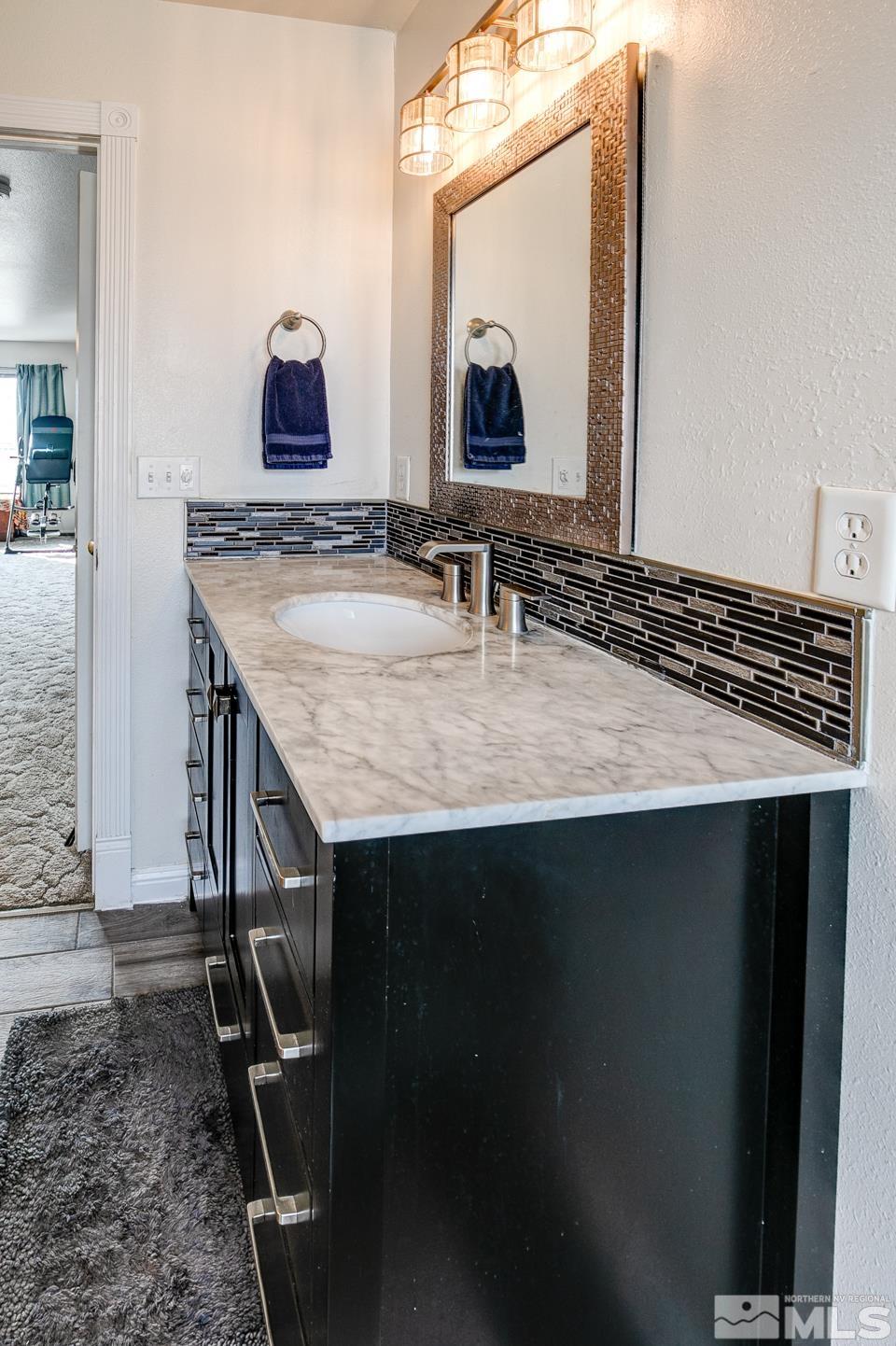 4170 Bottom Road Fallon, NV 89406 - Photo 27 of 38 a bathroom with a sink and a mirror