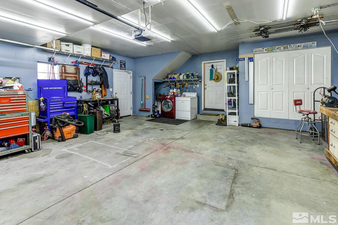 4170 Bottom Road Fallon, NV 89406 - Photo 30 of 38 a view of a garage with storage and a car