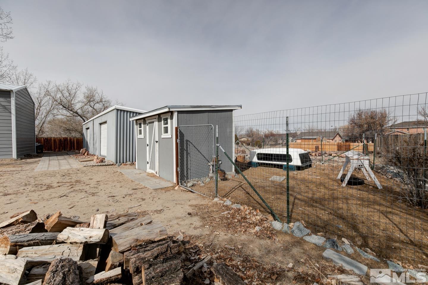 4170 Bottom Road Fallon, NV 89406 - Photo 32 of 38 a view of a house with a backyard space and parking