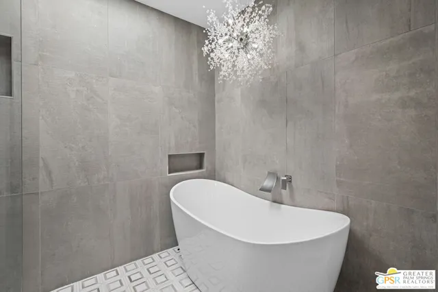 a white bath tub sitting in a bathroom