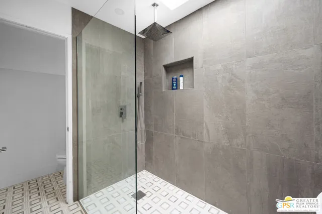 a bathroom with a shower and a sink