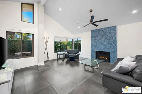 a living room with furniture and a fireplace