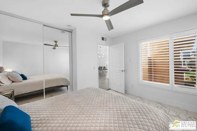 a bedroom with furniture and a window