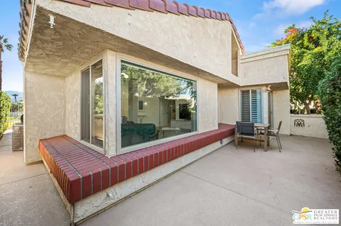 a view of sitting area in front of house