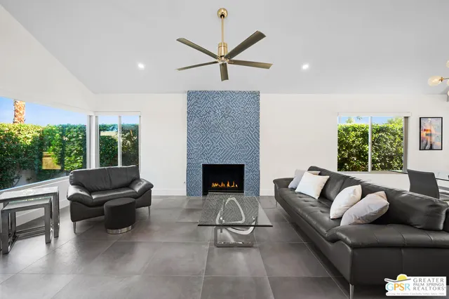 a living room with furniture and a fireplace