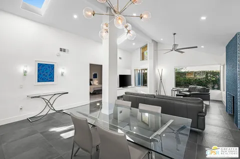 a dining room with furniture and window
