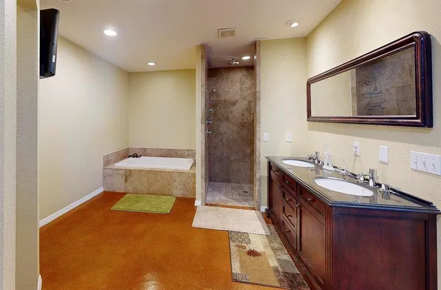 a bathroom with a sink a toilet and mirror