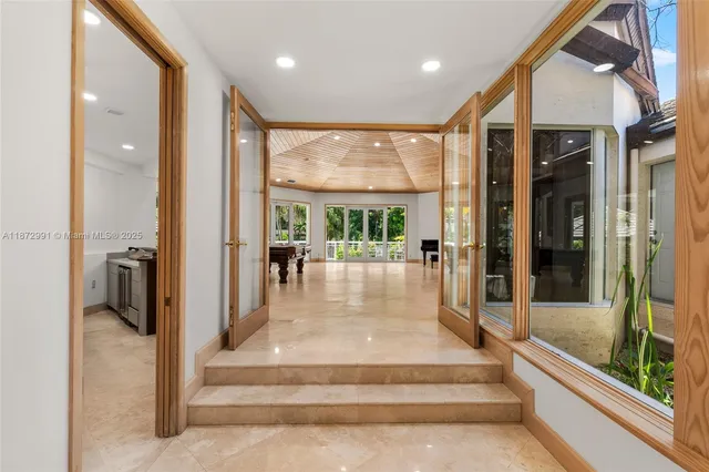 a lobby with furniture and window