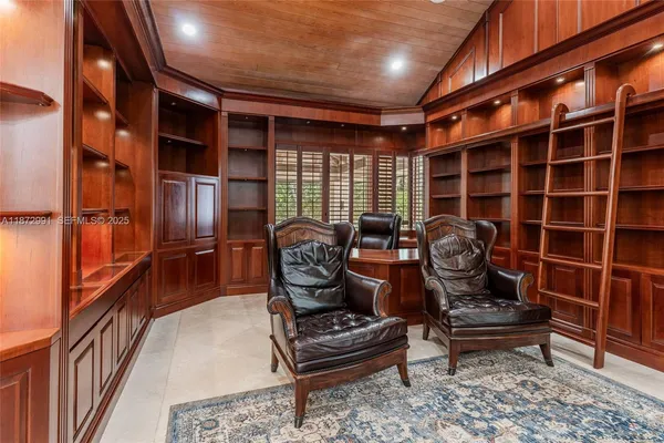 a view of a room with gym equipment and floor to ceiling window