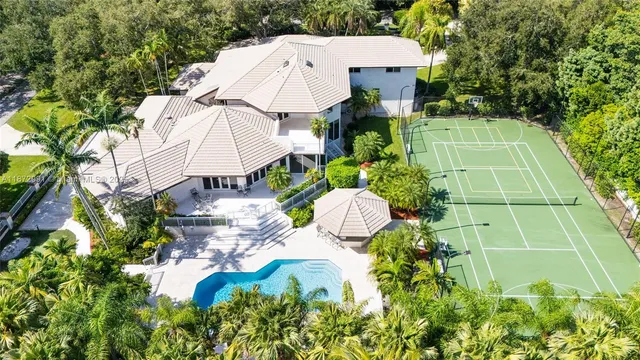a view of a house with a yard and sitting area