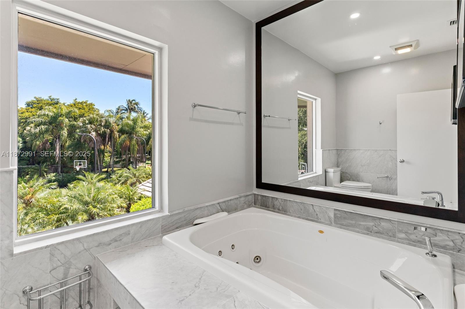6190 Southwest 102nd Street Pinecrest, FL 33156 - Photo 30 of 52 a bathroom with a bathtub and a sink