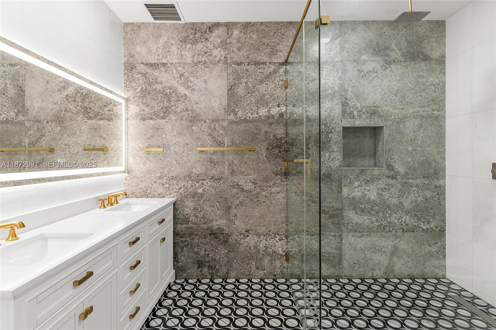 6190 Southwest 102nd Street Pinecrest, FL 33156 - Photo 35 of 52 a bathroom with a sink mirror and shower