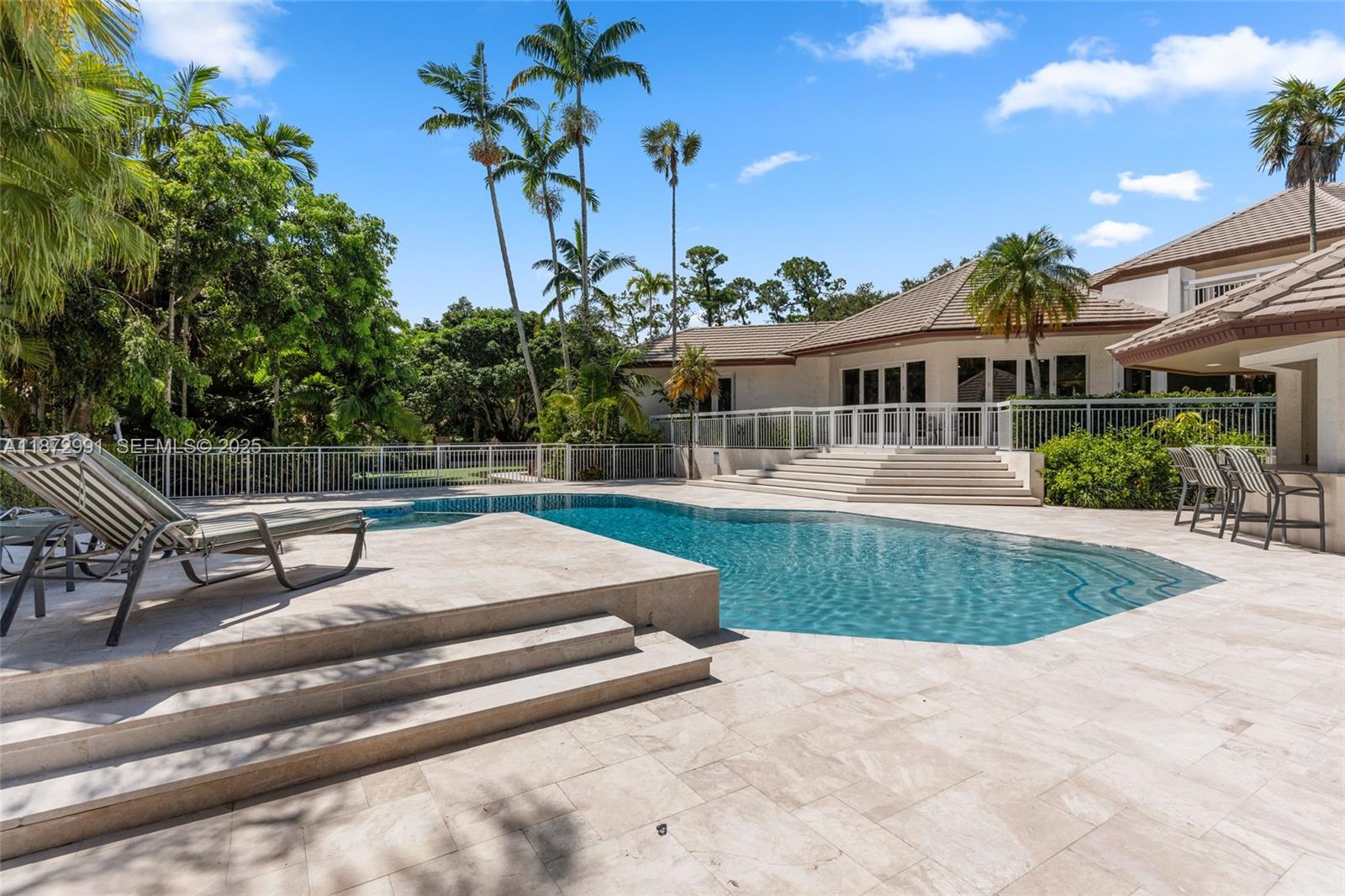 6190 Southwest 102nd Street Pinecrest, FL 33156 - Photo 43 of 52 a view of a house with pool and sitting area