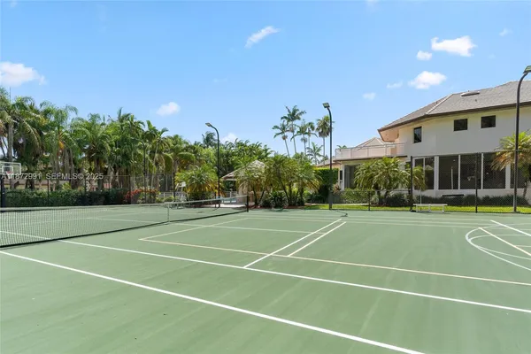 an aerial view of a house with pool and garden