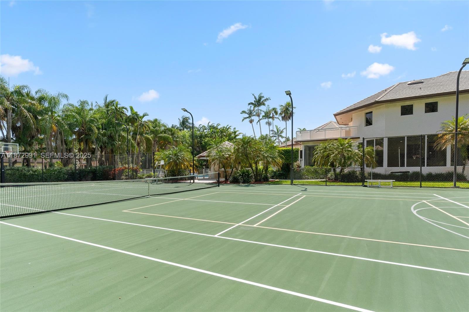 6190 Southwest 102nd Street Pinecrest, FL 33156 - Photo 49 of 52 a view of a tennis court
