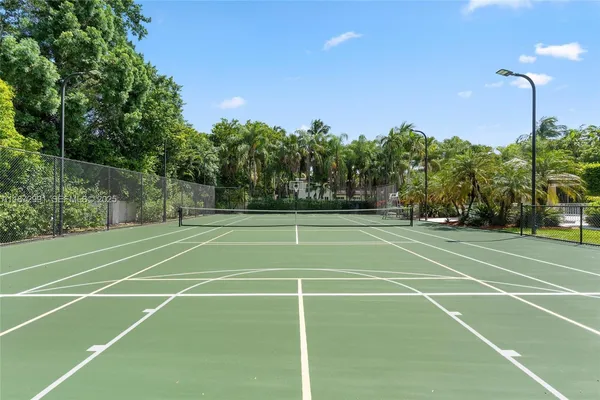 an aerial view of a house with swimming pool and garden
