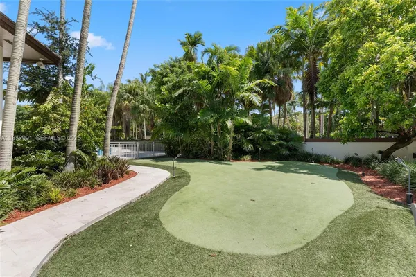 a view of swimming pool with a yard