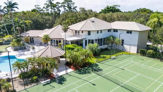 an aerial view of a house with a yard and garden