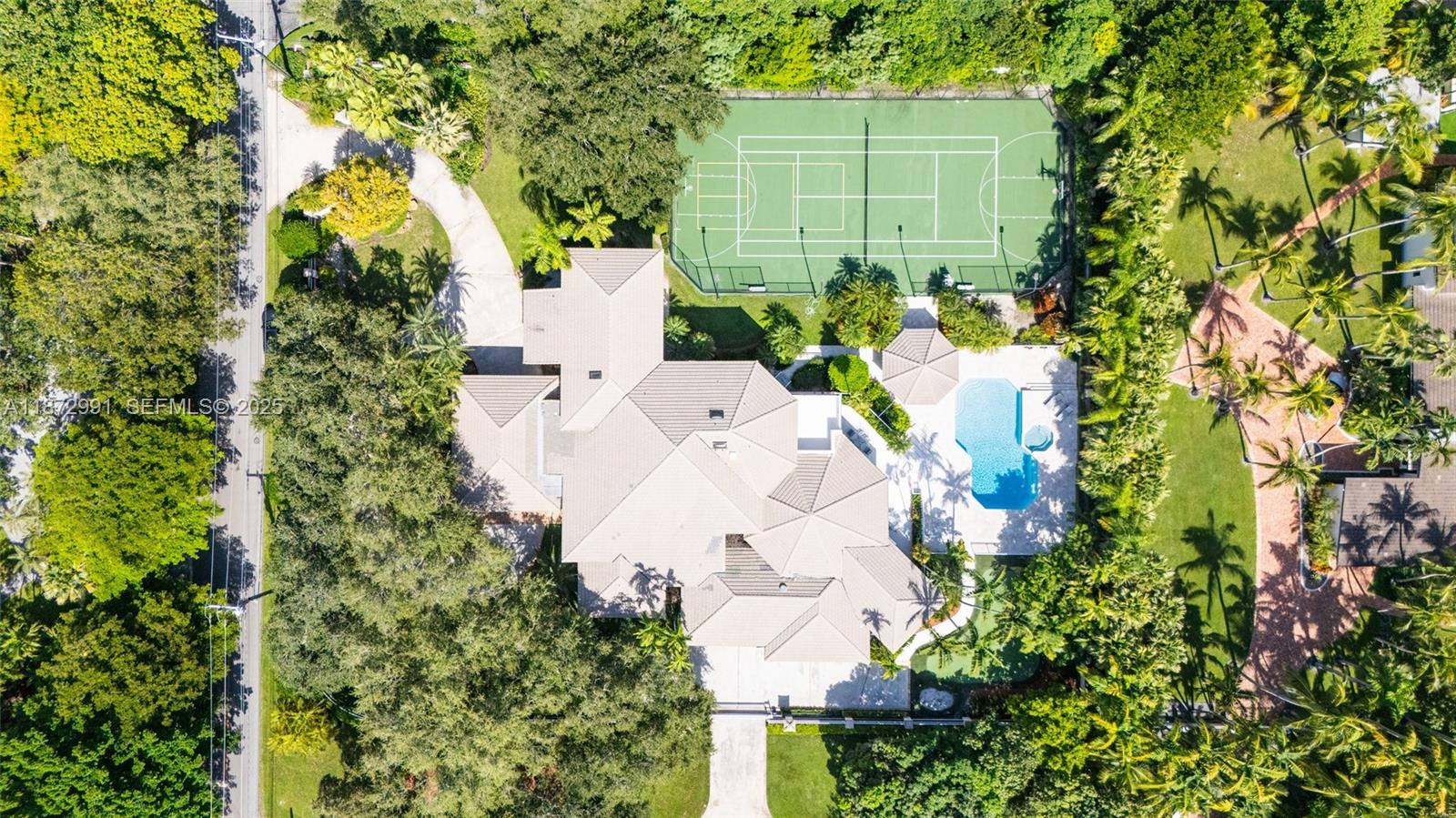 6190 Southwest 102nd Street Pinecrest, FL 33156 - Photo 9 of 52 an aerial view of a house with a yard and garden