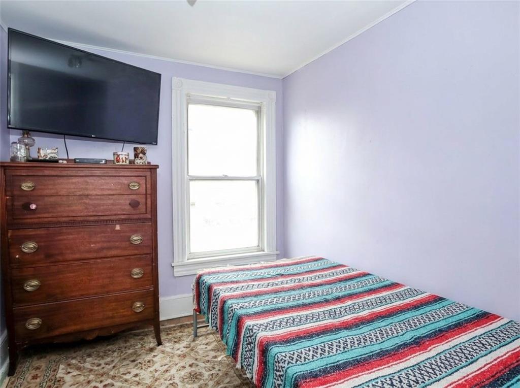 636 Holmdel Road Hazlet, NJ 07730 - Photo 26 of 47 a bedroom with a bed and flat screen tv