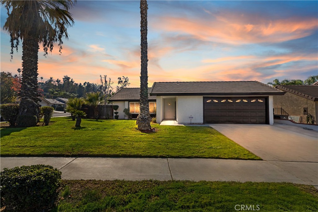 3136 Cherokee Street Riverside, CA 92503 - Photo 1 of 1 a front view of a house with a garden