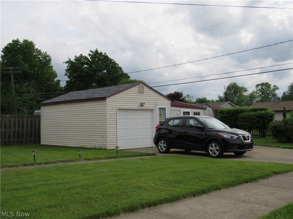 4836 Forest Road Mentor, OH 44060 - Photo 23 of 31 Rear yard with view of oversized one car garage with extra storage room!