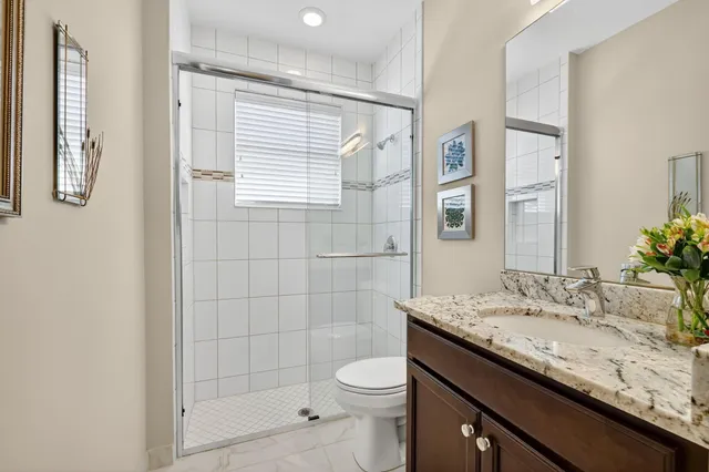 a street sign on a wall next to a road