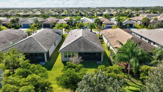 a view of swimming pool with outdoor seating and plants