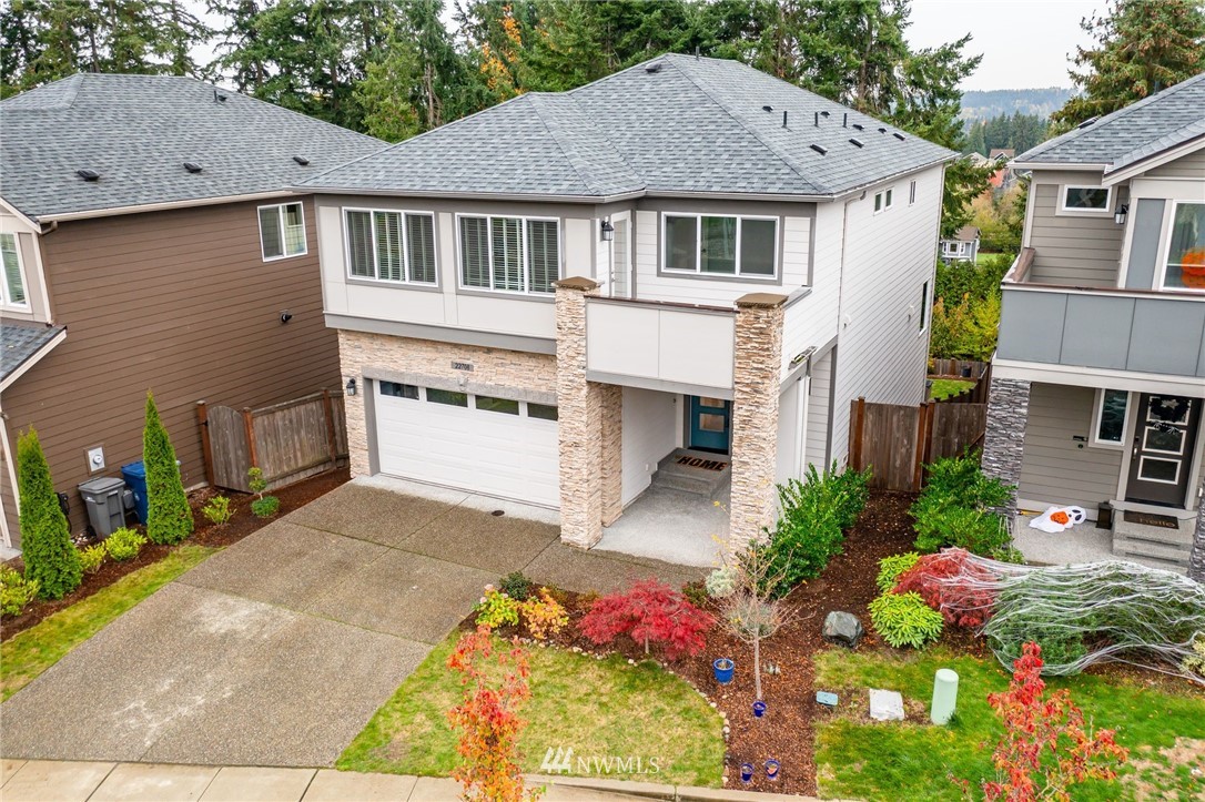 22708 41st Drive Southeast Bothell, WA 98021 - Photo 2 of 37 a front view of a house with a yard